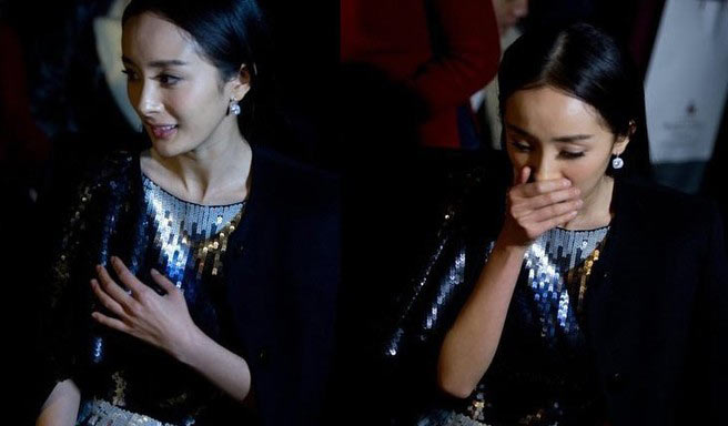 杨幂捂嘴似孕吐